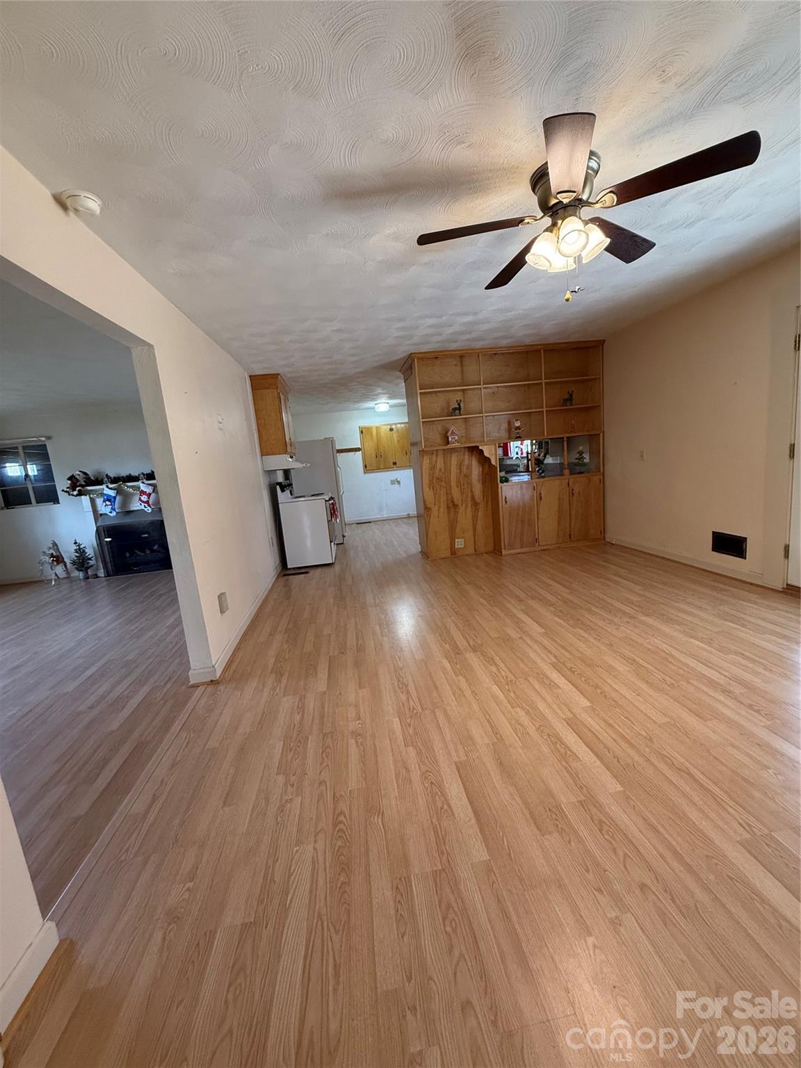 3532 16th Street Northeast, Unit 1 Hickory, NC 28601 - Photo 16 of 43 a view of a livingroom with furniture wooden floor ceiling fan and windows