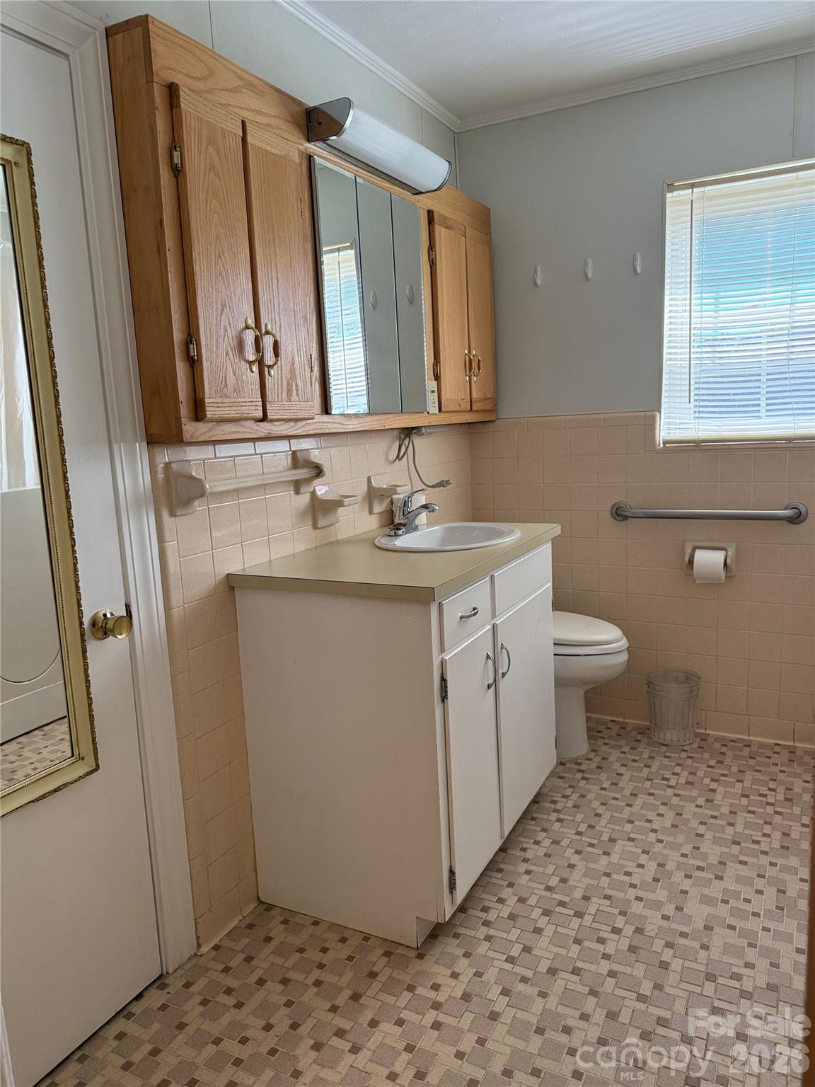 3532 16th Street Northeast, Unit 1 Hickory, NC 28601 - Photo 22 of 43 a bathroom with a sink a toilet and a mirror