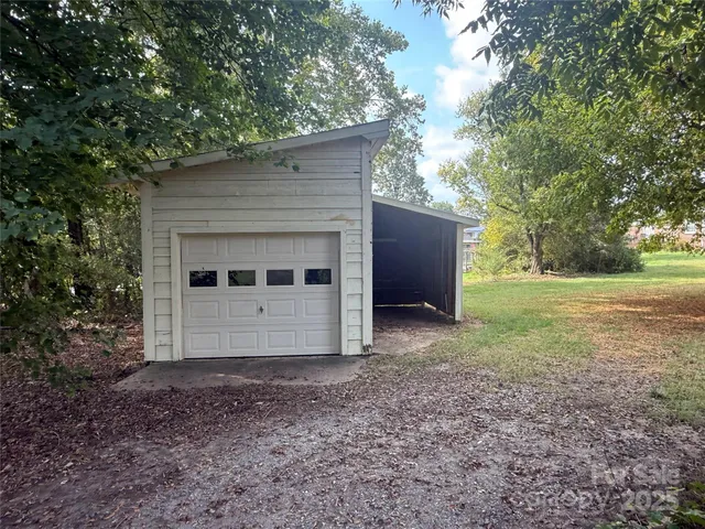 a kitchen with lot of cabinets and wooden floor