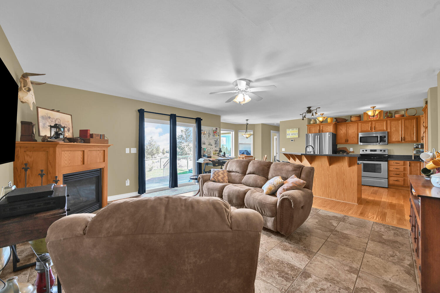 9345 Southwest Old West Road Powell Butte, OR 97753 - Photo 16 of 48 16_living to kitchen