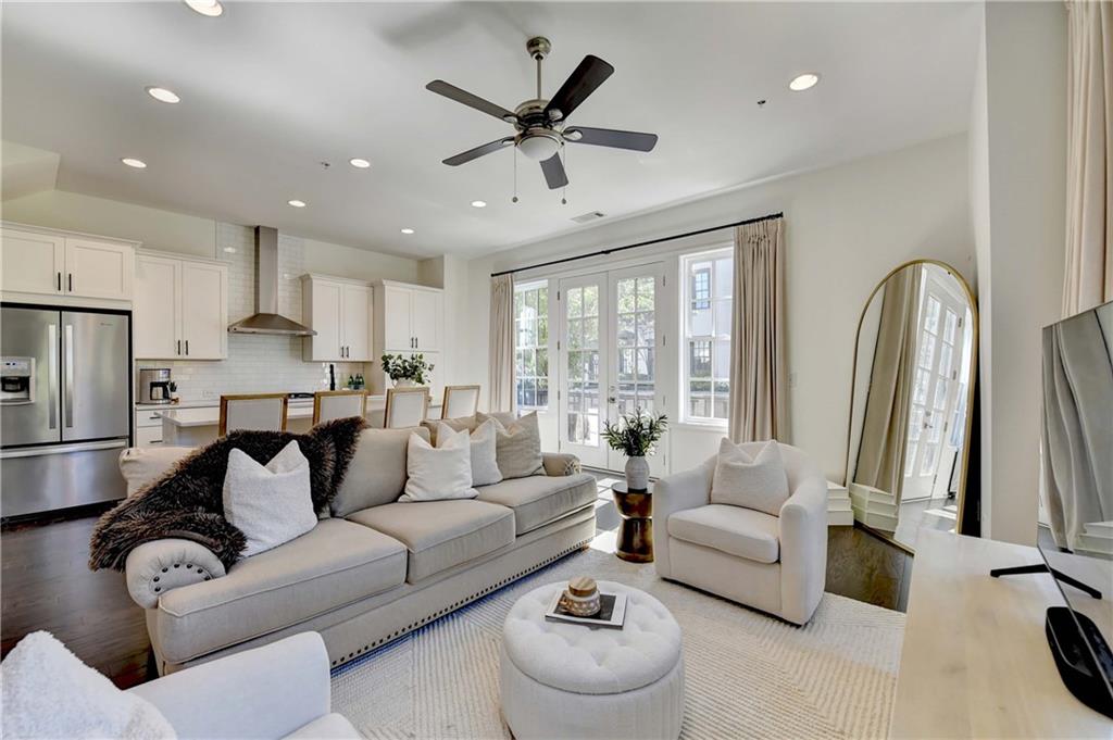 6602 Sterling Drive, Unit 688 Atlanta, GA 30328 - Photo 11 of 34 a living room with furniture and a large window
