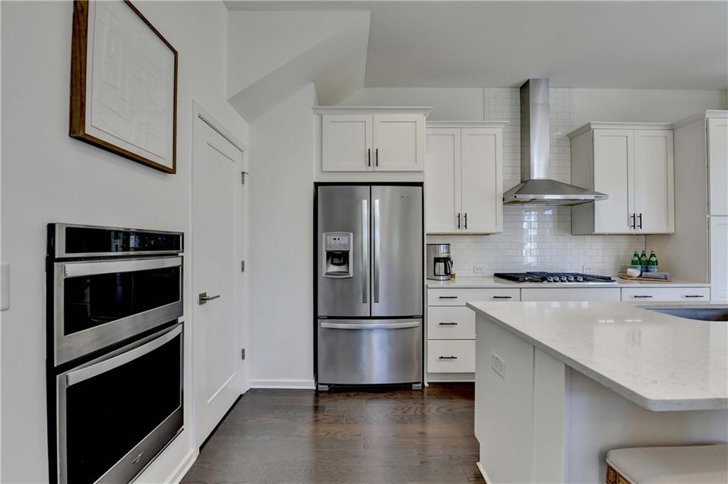 6602 Sterling Drive, Unit 688 Atlanta, GA 30328 - Photo 14 of 34 a kitchen with stainless steel appliances a refrigerator stove and sink
