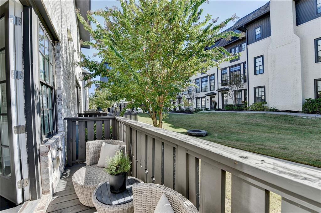 6602 Sterling Drive, Unit 688 Atlanta, GA 30328 - Photo 18 of 34 a view of balcony with two chairs and a table
