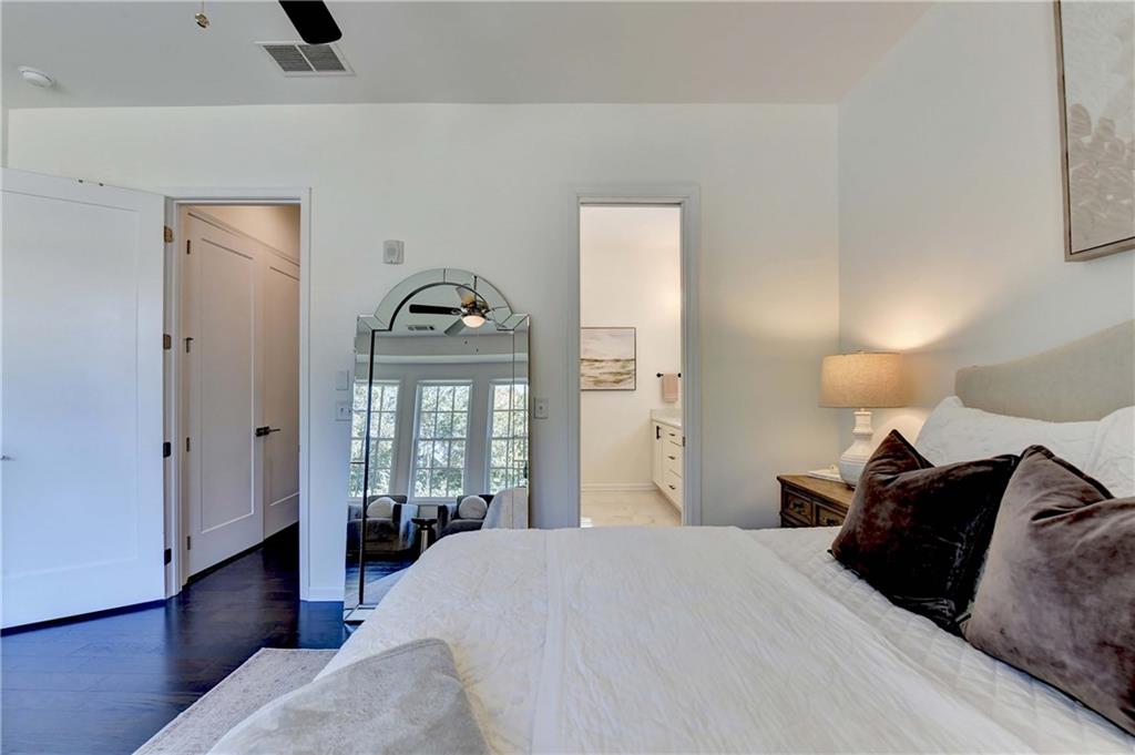 6602 Sterling Drive, Unit 688 Atlanta, GA 30328 - Photo 20 of 34 a bedroom with a bed and a window