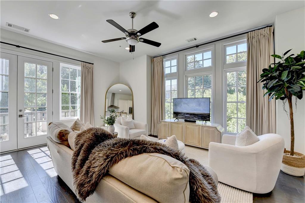 6602 Sterling Drive, Unit 688 Atlanta, GA 30328 - Photo 2 of 34 a living room with furniture and a large window