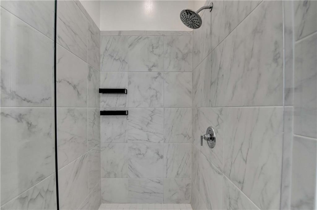 6602 Sterling Drive, Unit 688 Atlanta, GA 30328 - Photo 22 of 34 a bathroom with a shower