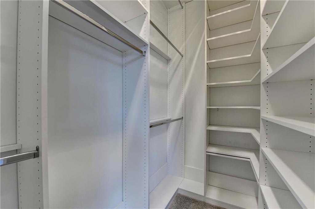 6602 Sterling Drive, Unit 688 Atlanta, GA 30328 - Photo 24 of 34 a view of walk in closet with empty racks