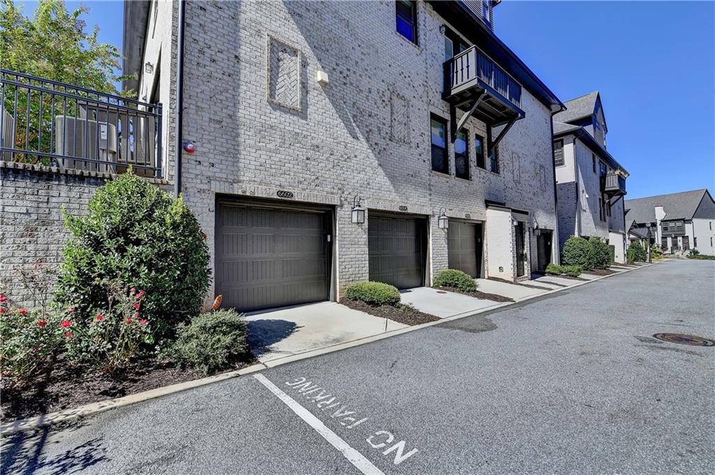 6602 Sterling Drive, Unit 688 Atlanta, GA 30328 - Photo 27 of 34 a front view of a house with yard