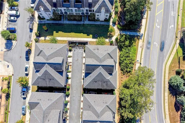 a view of a house next to a yard