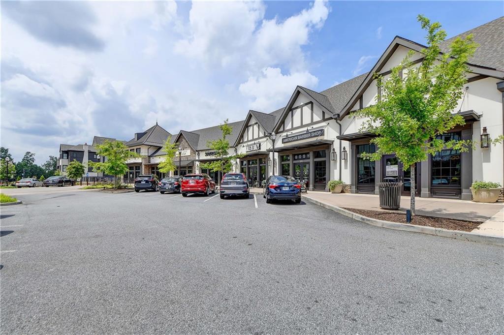 6602 Sterling Drive, Unit 688 Atlanta, GA 30328 - Photo 33 of 34 a building with trees in front of it