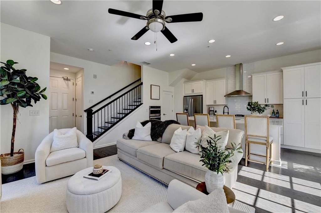 6602 Sterling Drive, Unit 688 Atlanta, GA 30328 - Photo 4 of 34 a living room with furniture and a potted plant