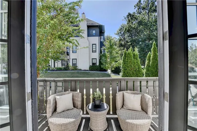 a view of a chair and table in the balcony