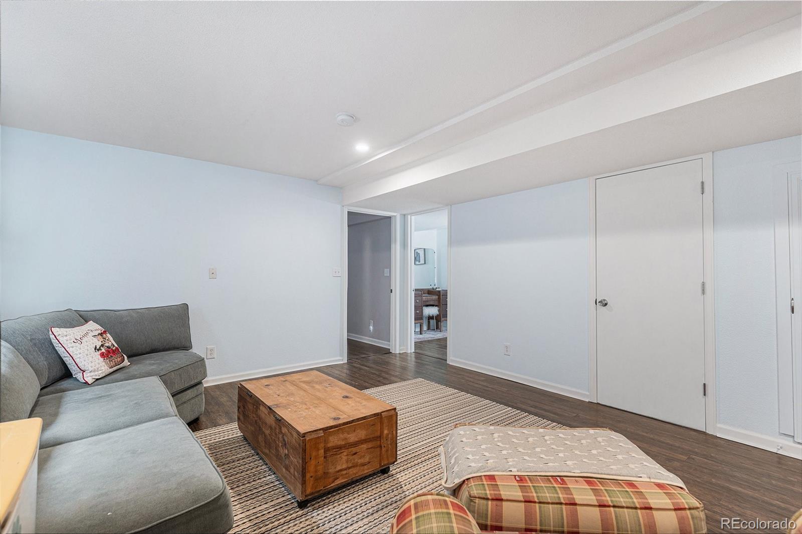 15482 Gadsden Drive Brighton, CO 80603 - Photo 24 of 43 a bedroom with a bed and a couch