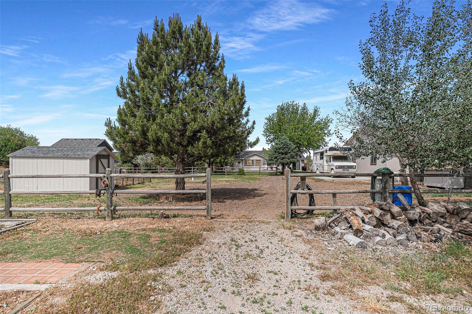 15482 Gadsden Drive Brighton, CO 80603 - Photo 39 of 43 a view of a bench in a backyard