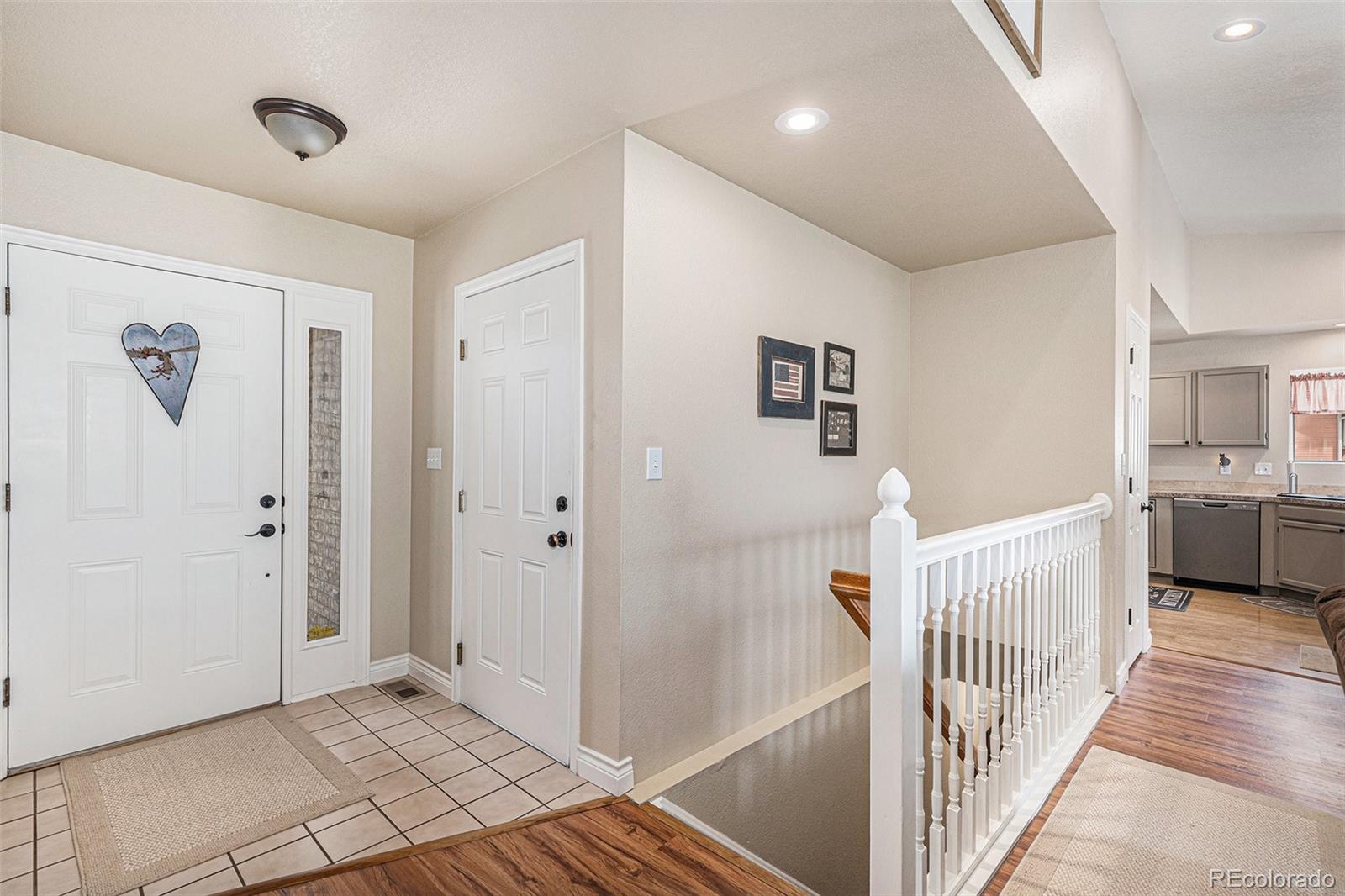 15482 Gadsden Drive Brighton, CO 80603 - Photo 8 of 43 a view of a hallway with a bedroom
