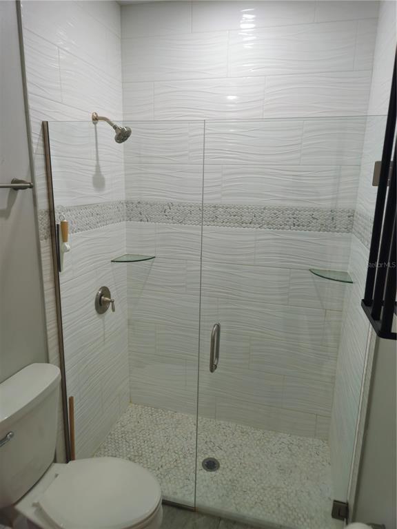 3633 Main Street Sanford, FL 32771 - Photo 10 of 17 a bathroom with a toilet and a shower