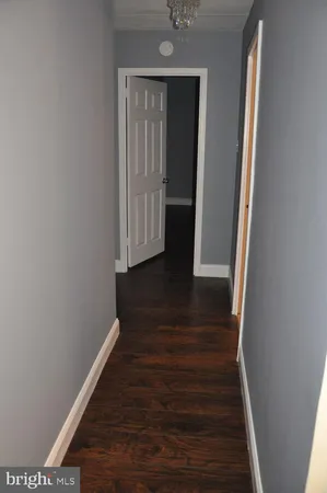 a view of front door with wooden floor