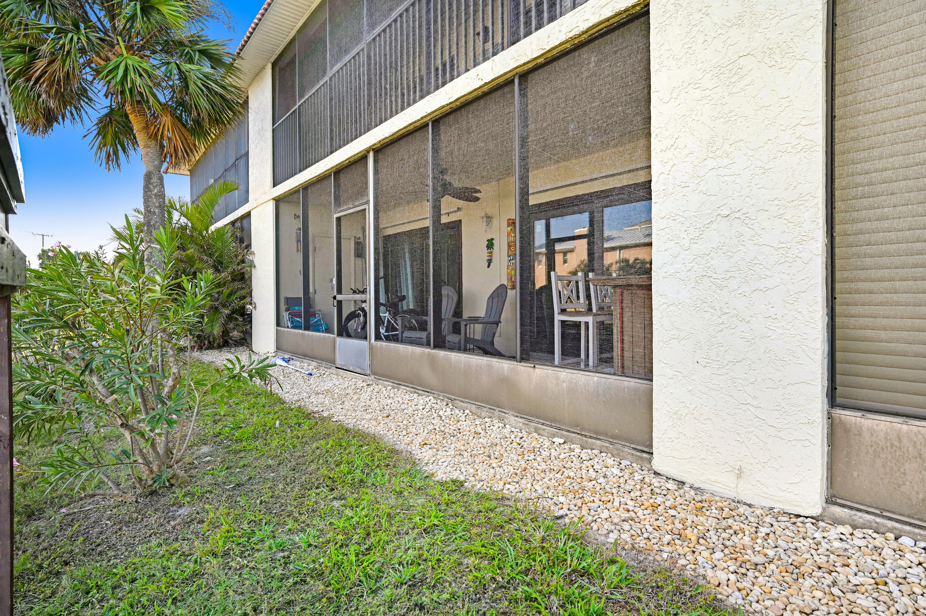 6655 Ridgewood Avenue, Unit 104 Cocoa Beach, FL 32931 - Photo 14 of 25 a view of a house with a balcony