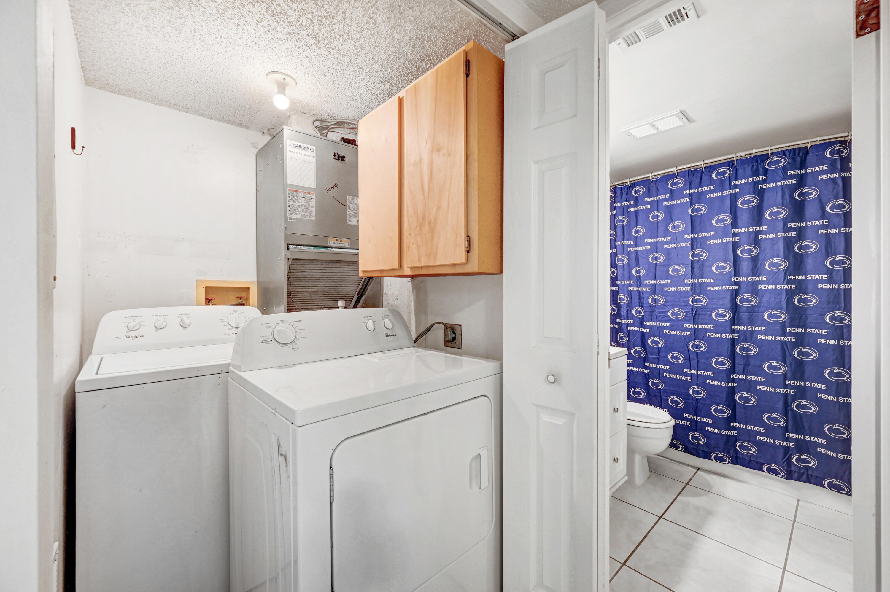 6655 Ridgewood Avenue, Unit 104 Cocoa Beach, FL 32931 - Photo 22 of 25 a utility room with dryer and washer