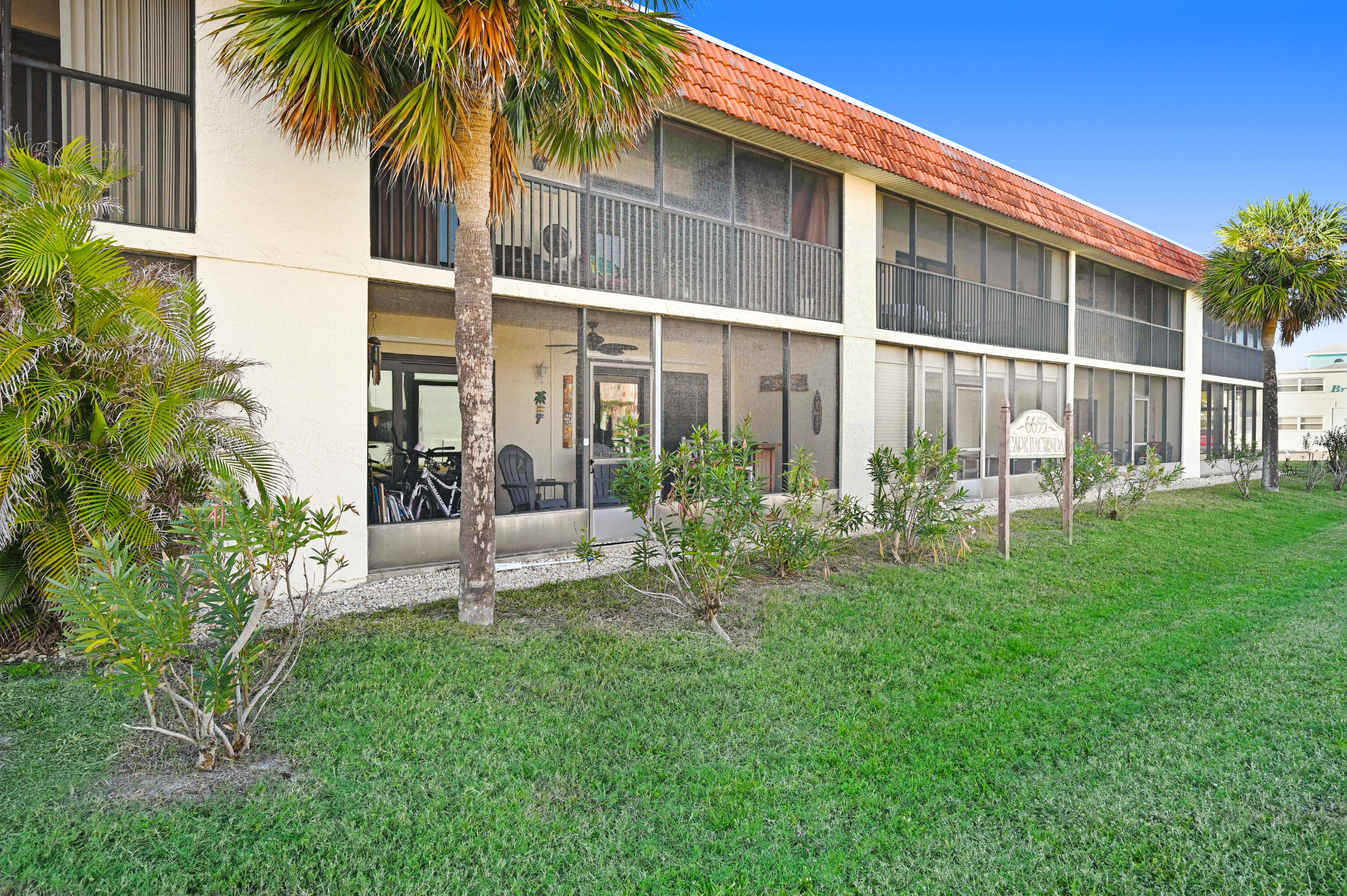 6655 Ridgewood Avenue, Unit 104 Cocoa Beach, FL 32931 - Photo 24 of 25 a garden view with a seating space