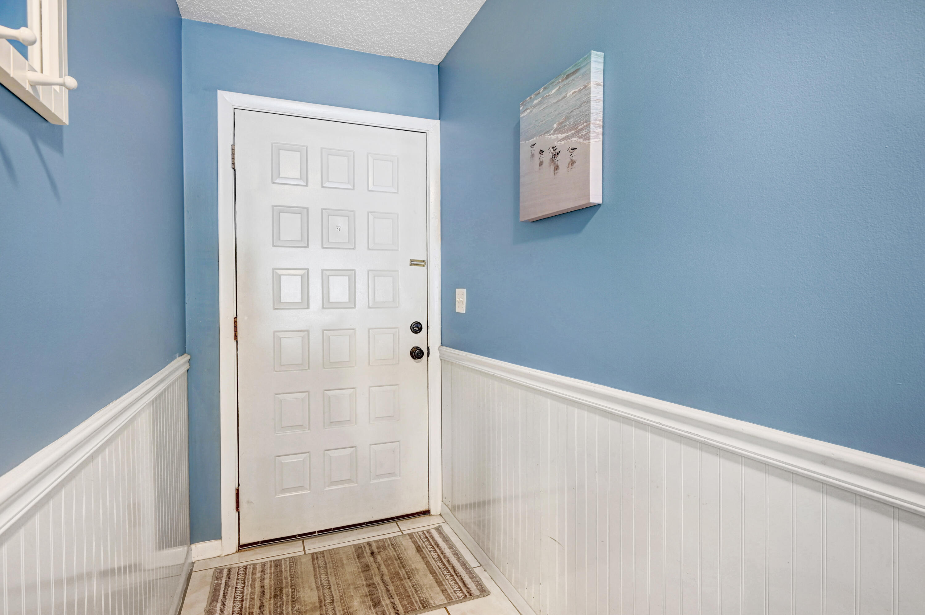 6655 Ridgewood Avenue, Unit 104 Cocoa Beach, FL 32931 - Photo 3 of 25 a view of front door