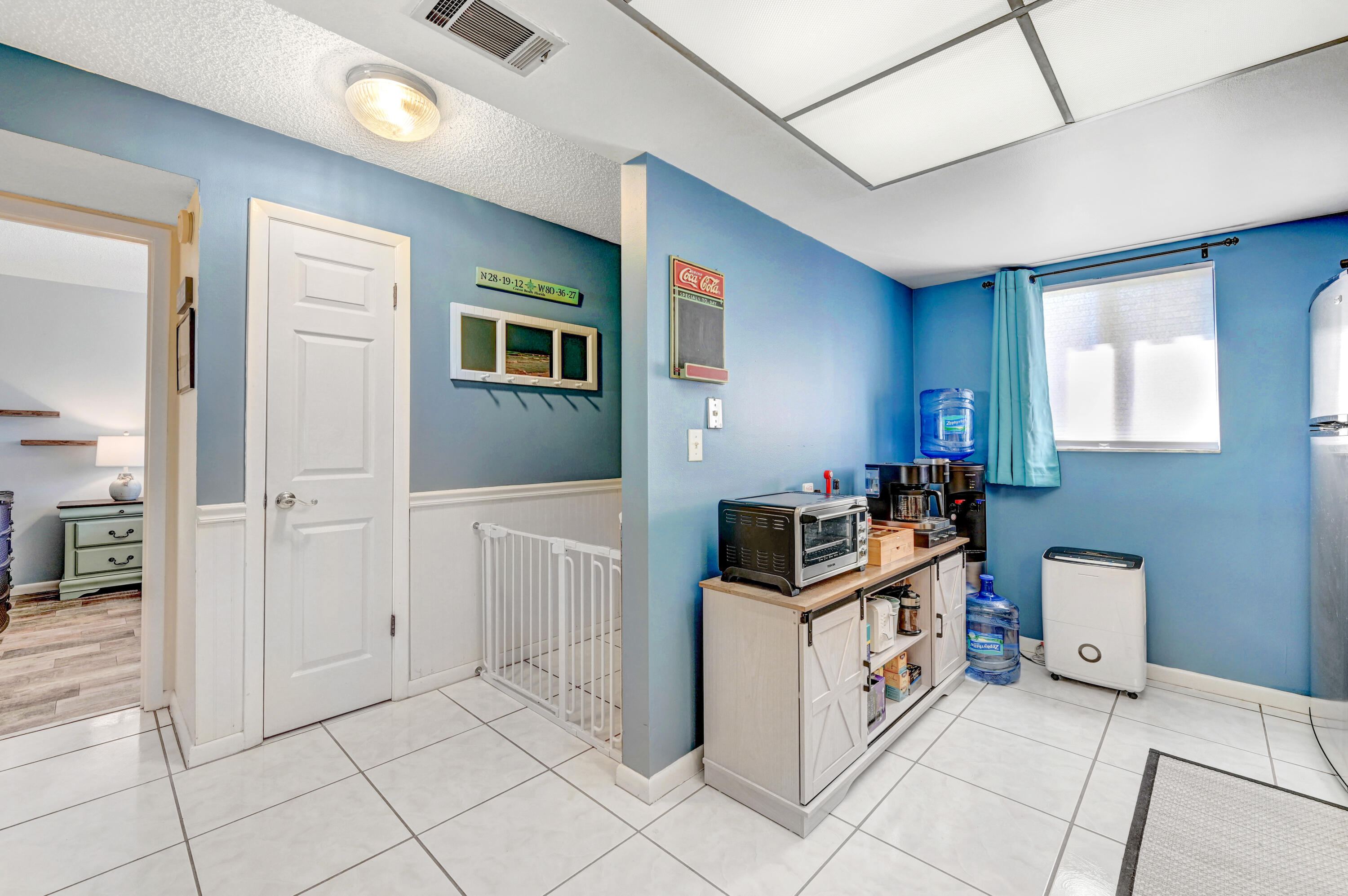 6655 Ridgewood Avenue, Unit 104 Cocoa Beach, FL 32931 - Photo 7 of 25 a kitchen with cabinets and steel appliances