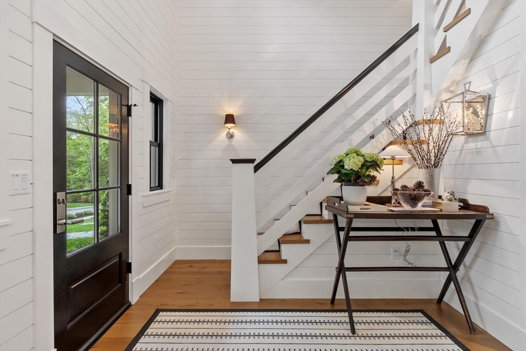 653 Main Street Concord, MA 01742 - Photo 3 of 42 a balcony with table and chairs