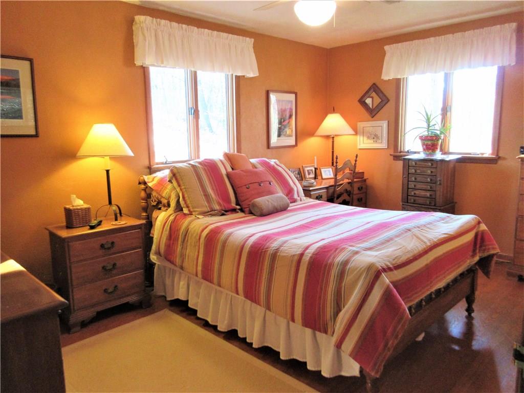 174 Elliott Road Sarver, PA 16055 - Photo 11 of 25 Main bedroom with hardwood floors and a lot of natural light coming in.