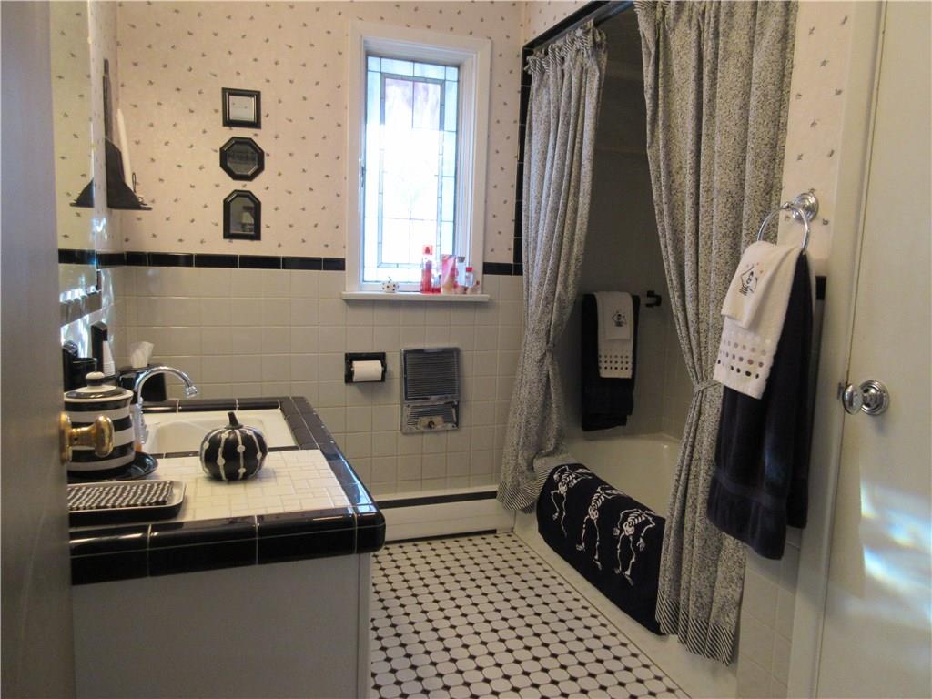 174 Elliott Road Sarver, PA 16055 - Photo 15 of 25 Main bathroom has ceramic tile floor, partially up the walls and in the tub/shower.