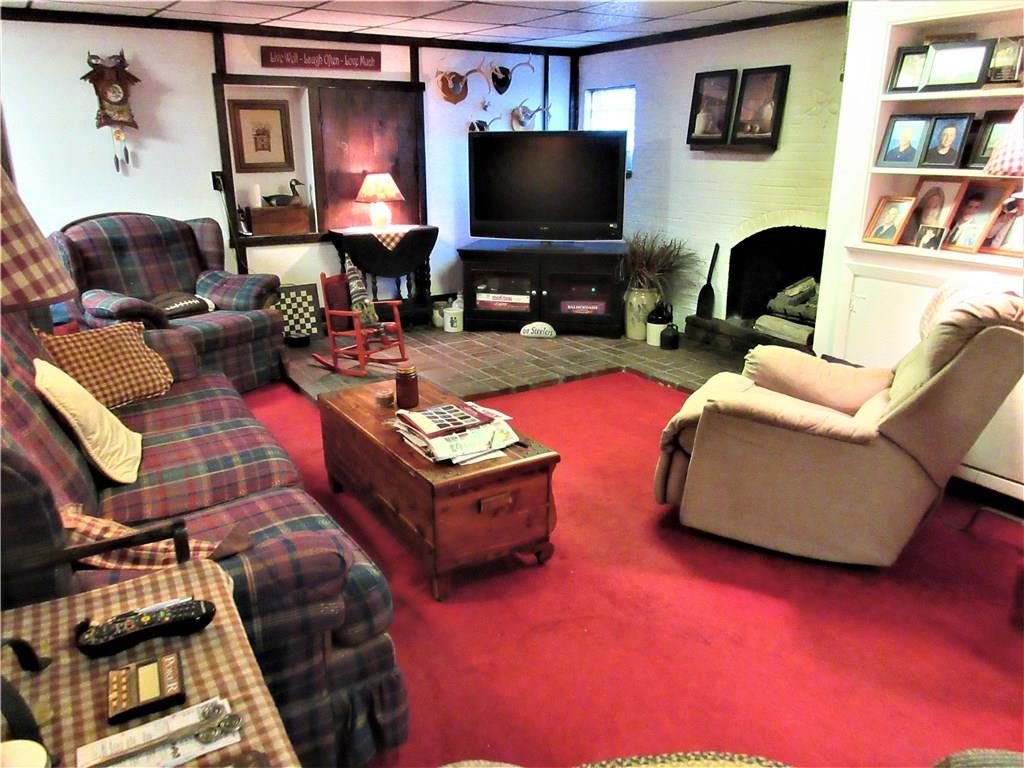 174 Elliott Road Sarver, PA 16055 - Photo 18 of 25 The other side of the gameroom that has a gas fireplace and plenty of room for your entertainment center.