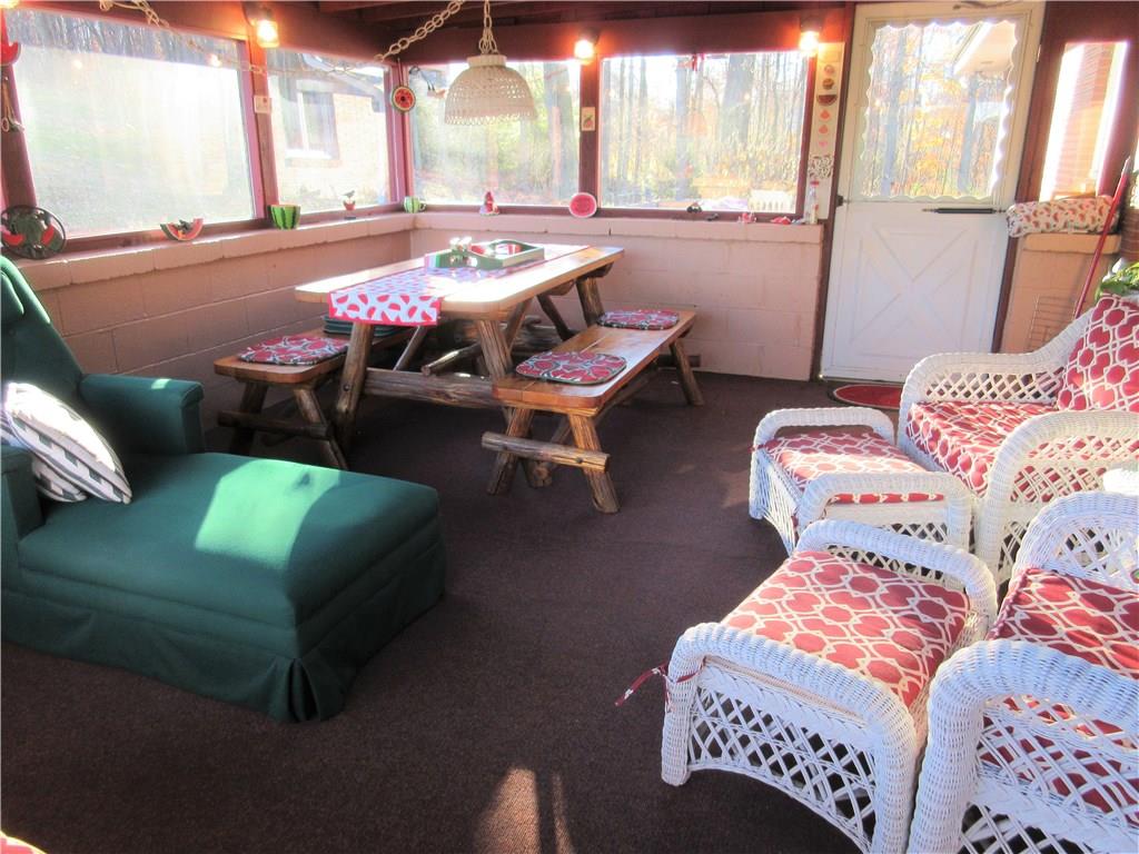 174 Elliott Road Sarver, PA 16055 - Photo 21 of 25 Enclosed 18 x 13 ft sunroom off the kitchen with a door going to the out door deck. Great area for your morning tea, lunch or dinner. One of the sellers favorite areas to hang out.