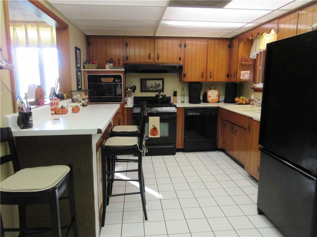174 Elliott Road Sarver, PA 16055 - Photo 8 of 25 Ceramic tile floor in kitchen, and there is a lot of counter space.