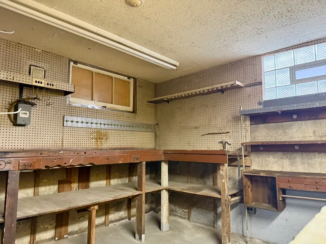 a view of a kitchen with a sink and cabinets