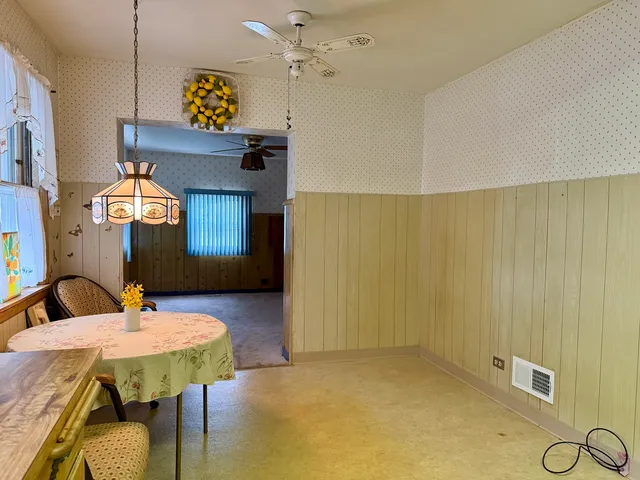 a view of a dining room with furniture