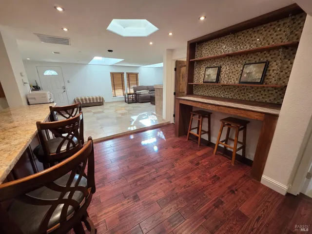 a view of kitchen with cabinets and wooden floor