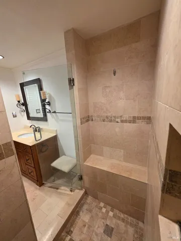 a bathroom with a bathtub and a shower