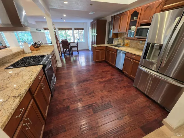 a kitchen with lots of counter top space and appliances