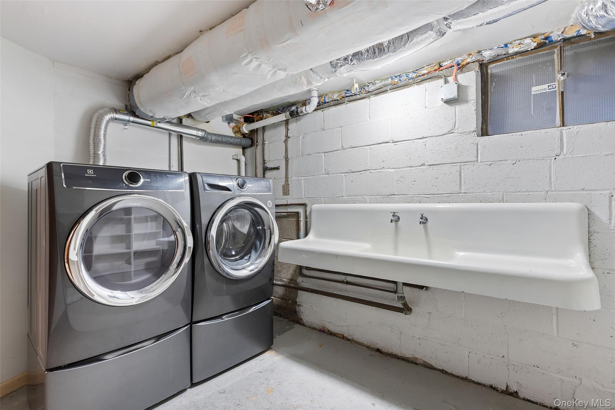 11 Muir Place New Rochelle, NY 10801 - Photo 21 of 30 Laundry Room with Double Sink