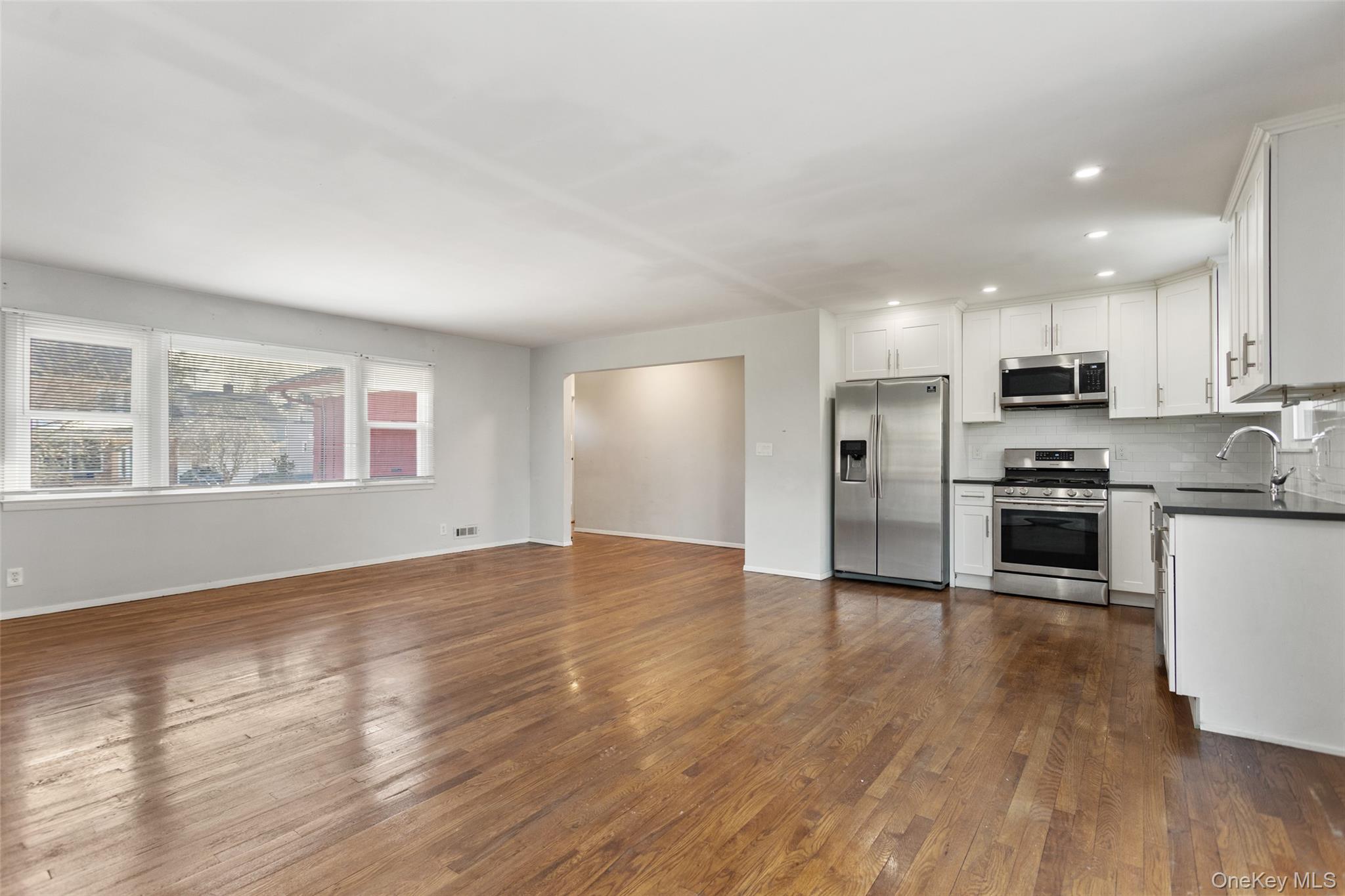 11 Muir Place New Rochelle, NY 10801 - Photo 9 of 30 Kitchen & Living Room from the Dining Area