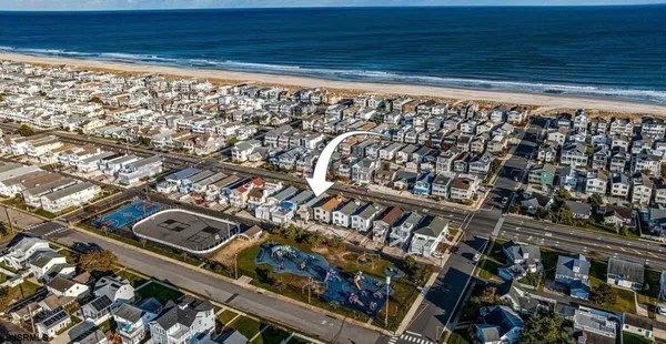 a view of swimming pool with outdoor seating