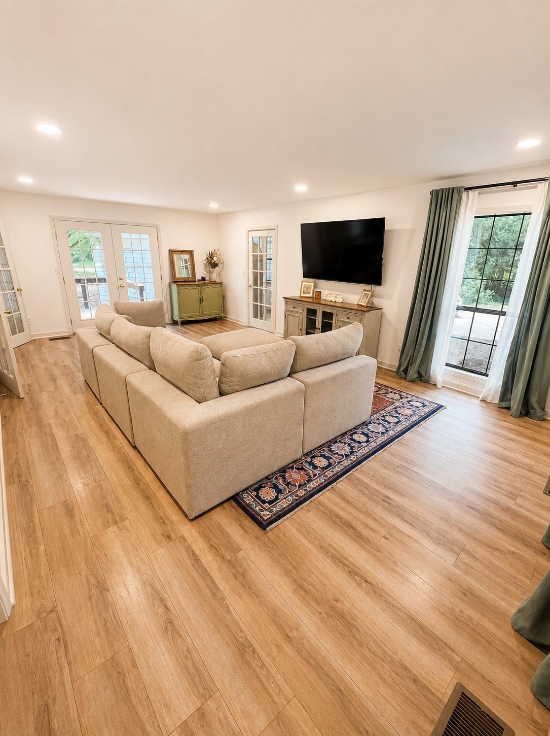 470 Rich Road Somerville, TN 38068 - Photo 18 of 40 Spacious living area featuring wood-finish flooring, recessed lighting, and multiple French doors
