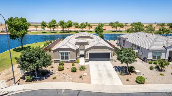 an aerial view of a house with a swimming pool