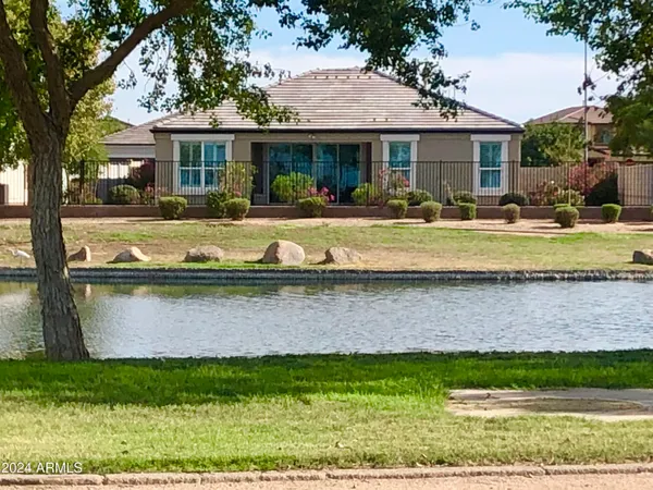 a front view of a house with a yard table and chairs