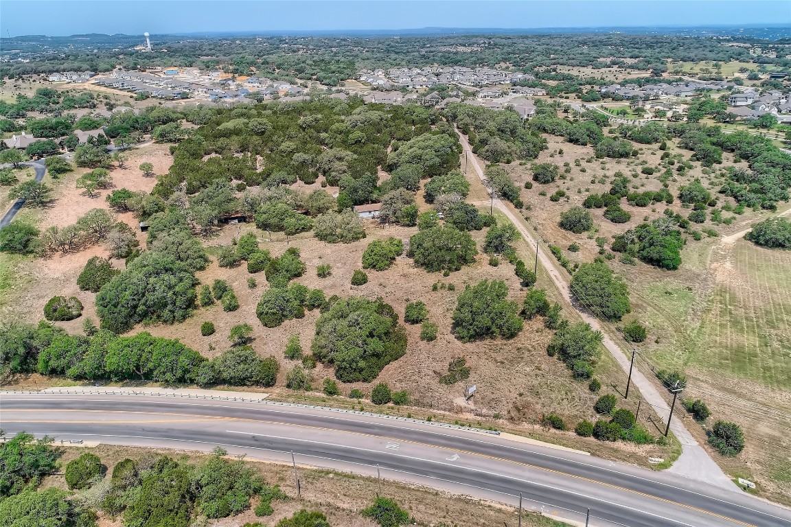 16316 Hamilton Pool Road Austin, TX 78738 - Photo 7 of 17 an aerial view of a houses with a yard