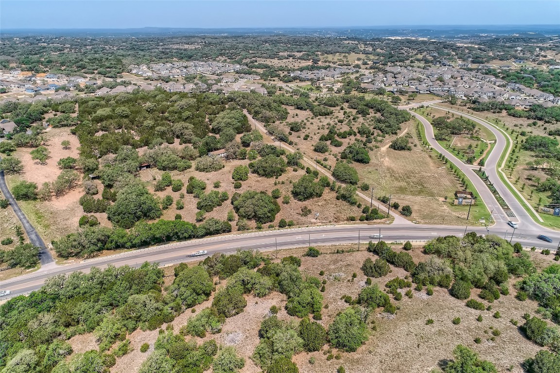 16316 Hamilton Pool Road Austin, TX 78738 - Photo 8 of 17 an aerial view of a house with a yard