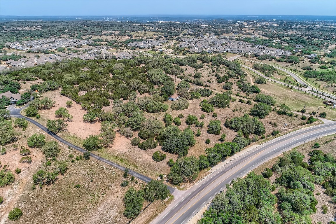 16316 Hamilton Pool Road Austin, TX 78738 - Photo 10 of 17 an aerial view of a residential houses covered with trees
