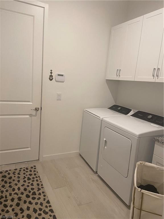 14866 Loggerhead Drive Naples, FL 34120 - Photo 13 of 16 a room with a cabinets and toilet