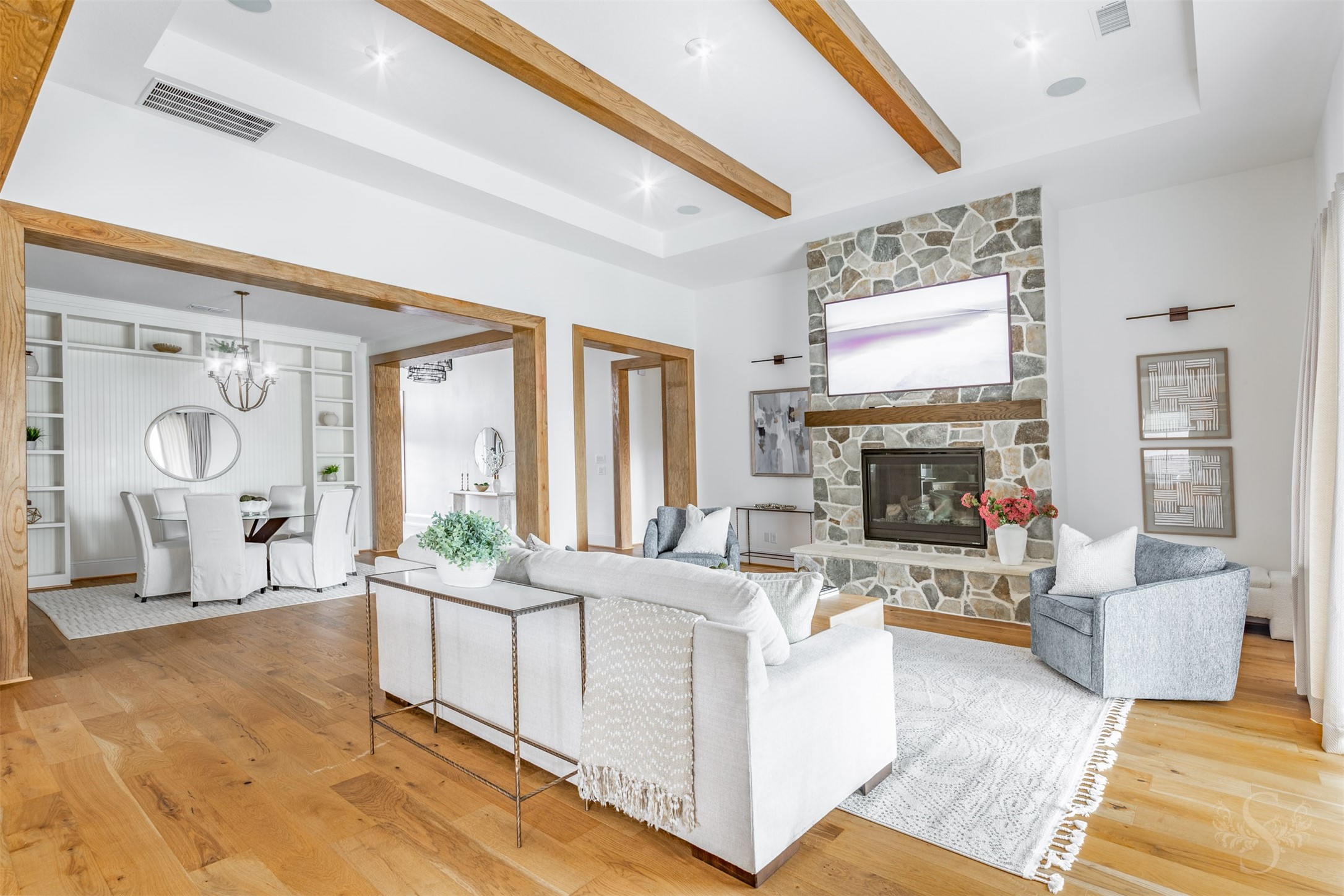 27919 Indigo Ridge Drive Fulshear, TX 77441 - Photo 16 of 50 a living room with furniture a fireplace and a large window