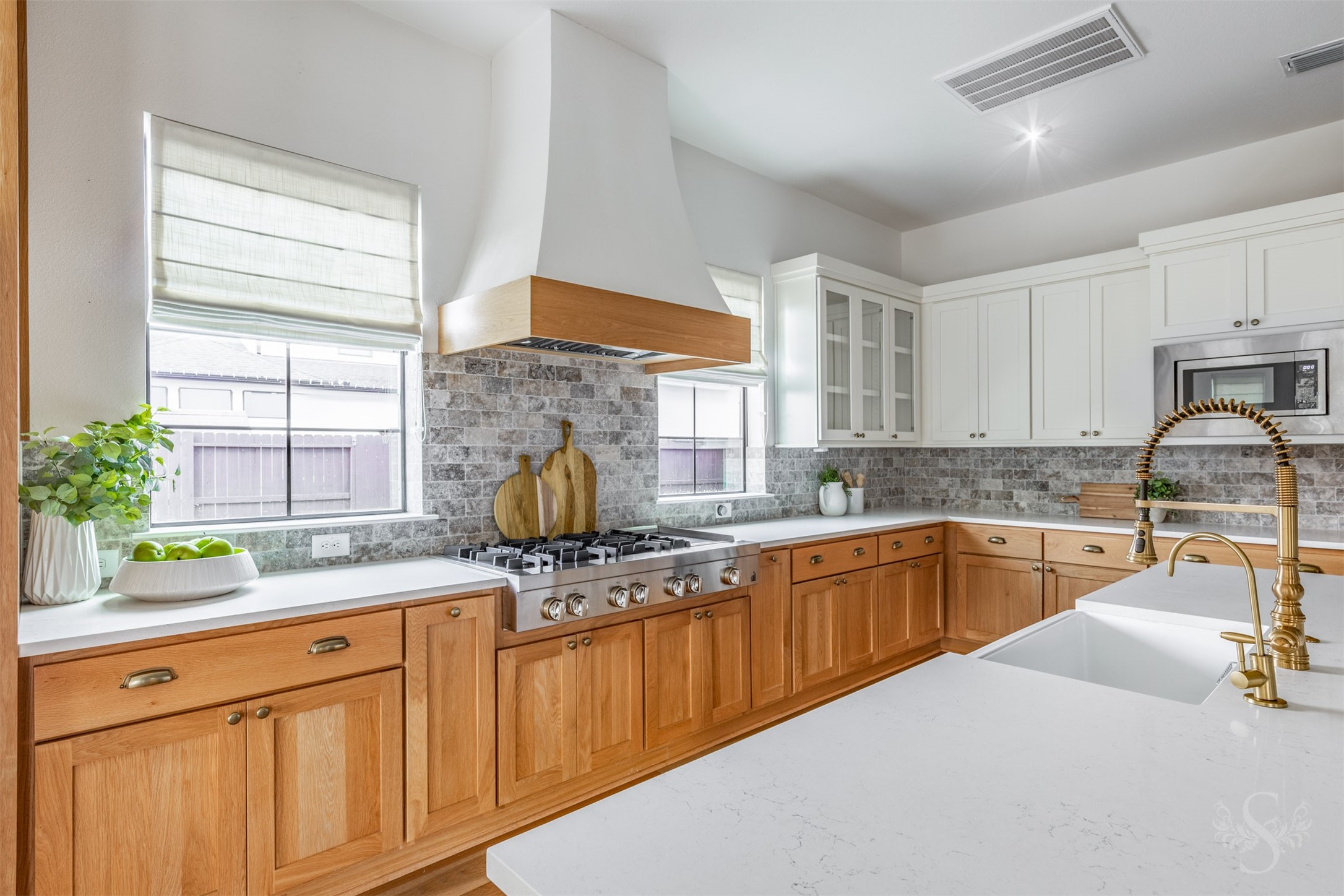 27919 Indigo Ridge Drive Fulshear, TX 77441 - Photo 19 of 50 a kitchen with kitchen island granite countertop a sink stainless steel appliances and cabinets