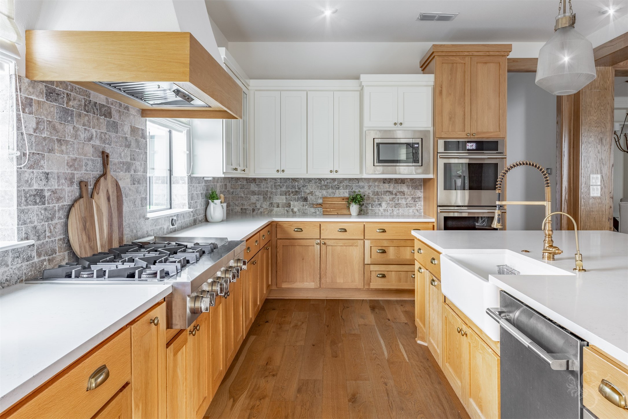 27919 Indigo Ridge Drive Fulshear, TX 77441 - Photo 21 of 50 a kitchen with stainless steel appliances granite countertop a sink stove and refrigerator